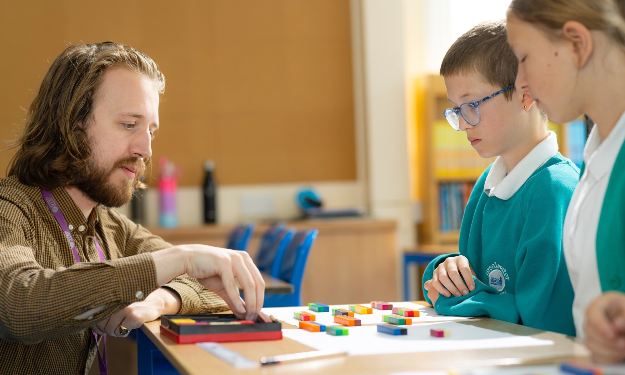 Breakwater Academy Image - Two Students and Teacher in Math Class